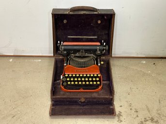 A Vintage Corona Typewriter, Circa 1920s, In Orange!