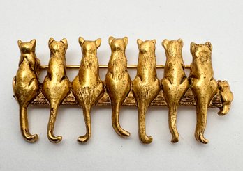 SIGNED MFA GOLD TONE ROW OF 7 CATS BROOCH