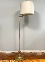 An Articulating Arm Brass Standing Lamp