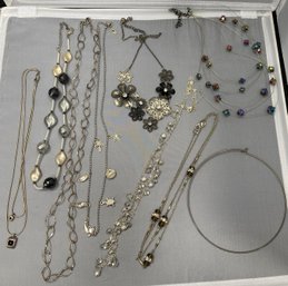 Nine Silver Colored Necklaces