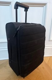 A Muji Of Japan Rolling Suitcase