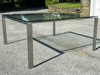 A Large Modern Brushed Steel And Glass Dining Table