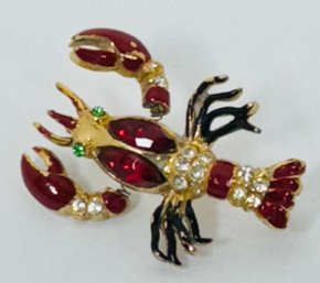 VINTAGE TREMBLER GOLD TONE RHINESTONE AND ENAMEL LOBSTER BROOCH