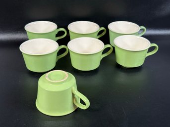 A Set Of Seven Vintage Cups In Lime Green Glazed Ceramic