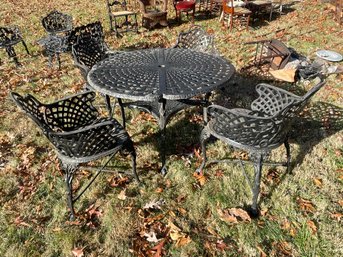 FIVE PIECE CAST ALUMINUM OUTDOOR TABLE AND CHAIRS