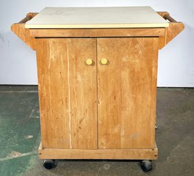 A Vintage Pine And Formica Rolling Kitchen Island Unit