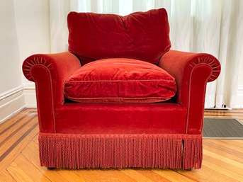 A Vintage Rolled Arm Chair In Red Velvet With Fringe Trim