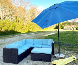 A Woven Acrylic Outdoor Sectional, Coffee Table, And Umbrella