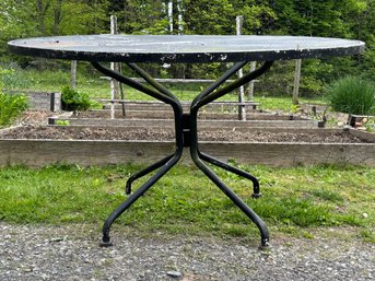 A Vintage Iron And Mesh Outdoor Dining Table