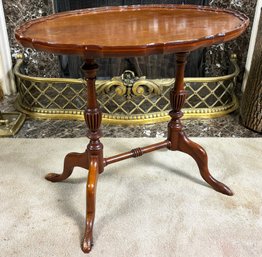 A Vintage English Mahogany Pie Crust Side Table With Trestle Base