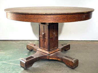 An Early 20th Century Mission Oak Pedestal Base Dining Table