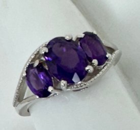 STERLING SILVER THREE STONE AMETHYST RING