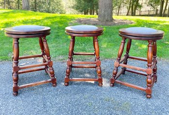 A Trio Of Bespoke Turned Wood Swivel Counter Stools With Nailhead Trim And Upholstered Seats