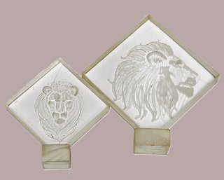 Two Laser Etched Plexiglas Lion Heads On Stands