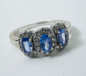 TANZANITE AND WHITE STONE STERLING SILVER RING