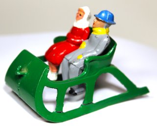 Dime Store Lead Woman And Man In Sled Christmas Holiday Figures