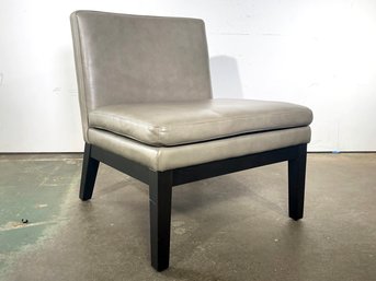 A Modern Leather Slipper Chair By West Elm