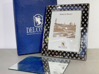 An Embossed Metal Photo Frame