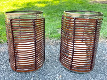 A Pair Of Leather Wrapped Candle Sconces With Brass Rims