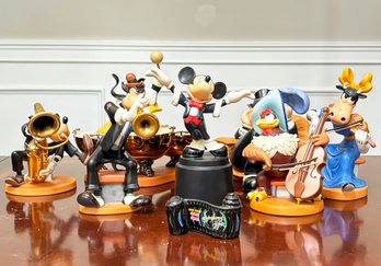 A Disney Music Box And Porcelain Figurines - Mickey Mouse And Symphony Hour