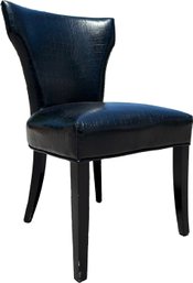 An Accent Chair In Black Snakeskin