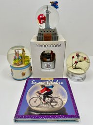 4 Snow Globes: New In Box Bloomingdales, Musical Peter Rabbit, M&Ms, Bird & Snow Globe Book