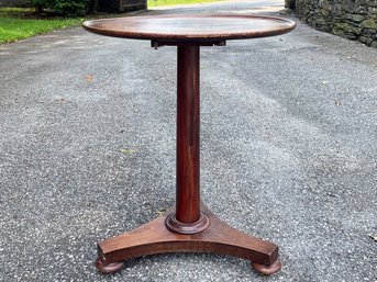 An Antique Mahogany Tilt Top Occasional Table