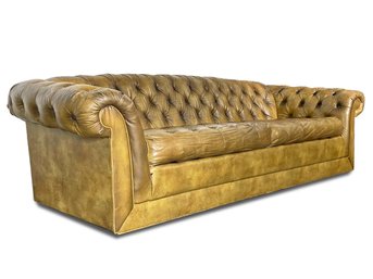 A Vintage Tufted Vinyl Chesterfield Sofa