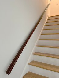 A 142' Wall Mounted Wood Hand Rail