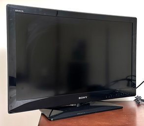 A Sony Bravia 32' TV On Stand