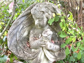 Standing Putti Holding A Satchel