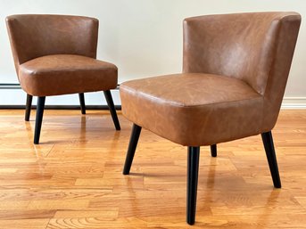 A Pair Of Modern Rally Chairs In Cognac Leather