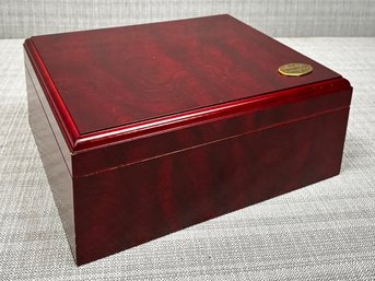 A Grained Red Wood Cigar Humidor With Brass Fittings By The Thompson Company