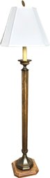 A Bronze Tone Stick Lamp On Carved Wood Base