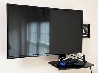 A 30' Insignia Roku TV On Wall Mount