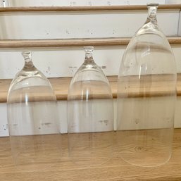 A Set Of 3 Glass Cloches