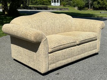 A Castro Convertible Camelback Loveseat