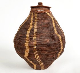 A Large Vintage Woven Lidded Basket, Clay Base.