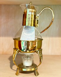 A Teapot And Warming Chafing Stand