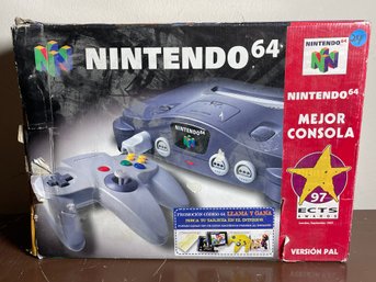 NINTENDO 64 PAL EDITION CIB ALONG WITH A BOX OF PAL EDITION NINTENDO 64 GAMES AND ACCESSORIES