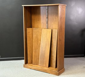 A Transitional Wooden Bookcase In A Medium Stain