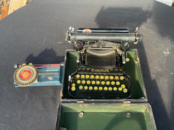 A VINTAGE CORONA TYPEWRITER AND A SIMPLEX