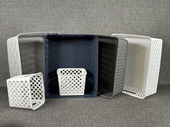 An Assortment Of Decorative Storage Bins With A Woven Texture