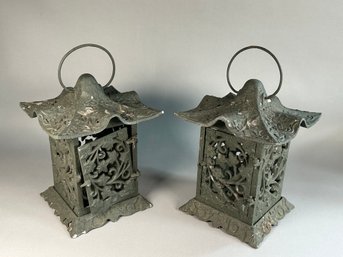 A Pair Of Metal Lanterns