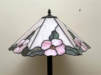 A Beautiful Floor Lamp With A Slag Glass Shade