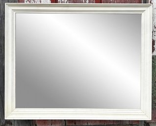 A Large Painted Wood Framed Mirror