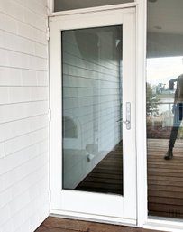 A Glass Panel Exterior Door And Pull Down Screen