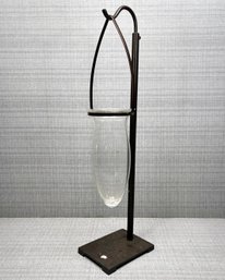 A Wrought Iron And Modern Glass Hanging Candle Sconce