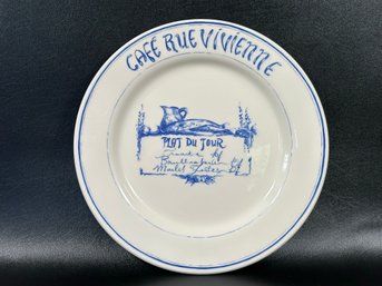 A Vintage French Cafe Themed Dinner Plate With A Naturally Worn Finish
