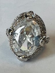 PRETTY SILVER TONE LARGE OVAL WHITE STONE CENTER WITH SURROUNDING SMALL WHITE STONES RING